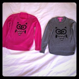 say what ? A pair of girls sweaters